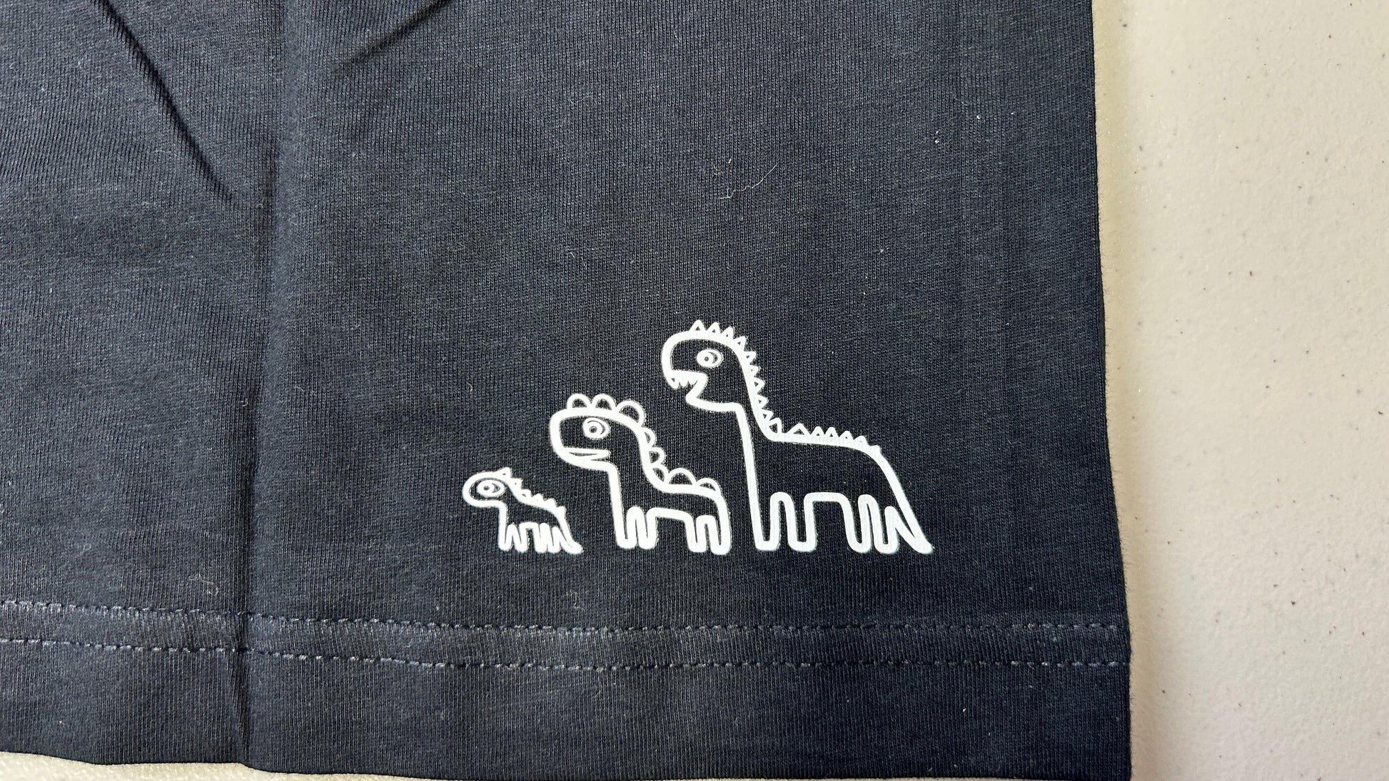 Bottom Right of shirt